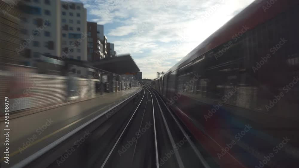 A view from inside the moving train through the city and tunnels. A view from inside the moving train through the city and tunnels.