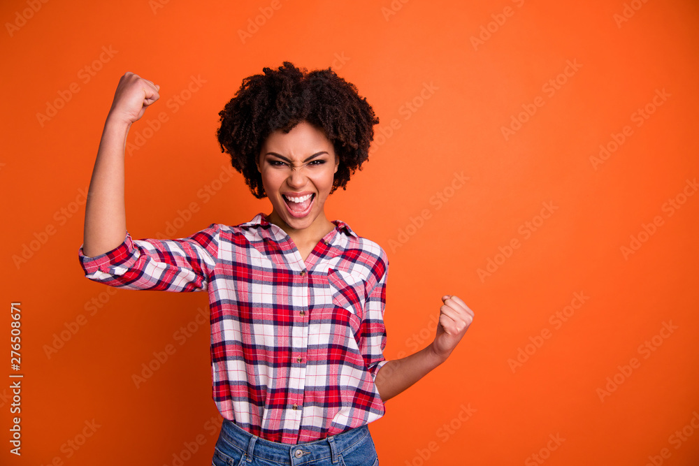 Portrait of her she nice attractive glad ecstatic cheerful cheery wavy-haired lady wearing checked shirt celebrating great winning success isolated over bright vivid shine orange background Portrait of her she nice attractive glad ecstatic cheerful cheery wavy-haired lady wearing checked shirt celebrating great winning success isolated over bright vivid shine orange background