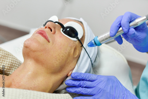 Woman receiving oxygen facial treatment