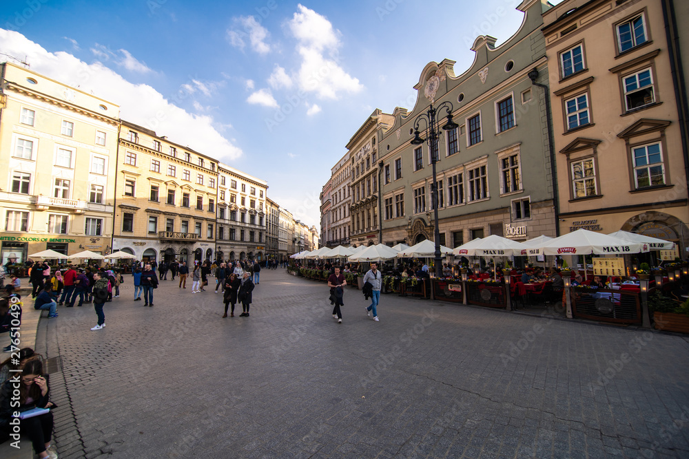 Poland, Krakow - April, 2019: Main Market Square and St Mary Church.