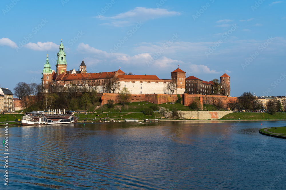 Krakow, Poland - April, 2019: Wawel castle famous landmark in Krakow Poland. Picturesque landscape on coast river Wisla.