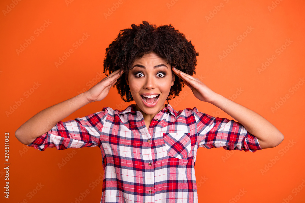 Close-up portrait of her she nice lovely cute attractive cheerful cheery amazed wavy-haired lady wearing checked shirt great news isolated on bright vivid shine orange background Close-up portrait of her she nice lovely cute attractive cheerful cheery amazed wavy-haired lady wearing checked shirt great news isolated on bright vivid shine orange background
