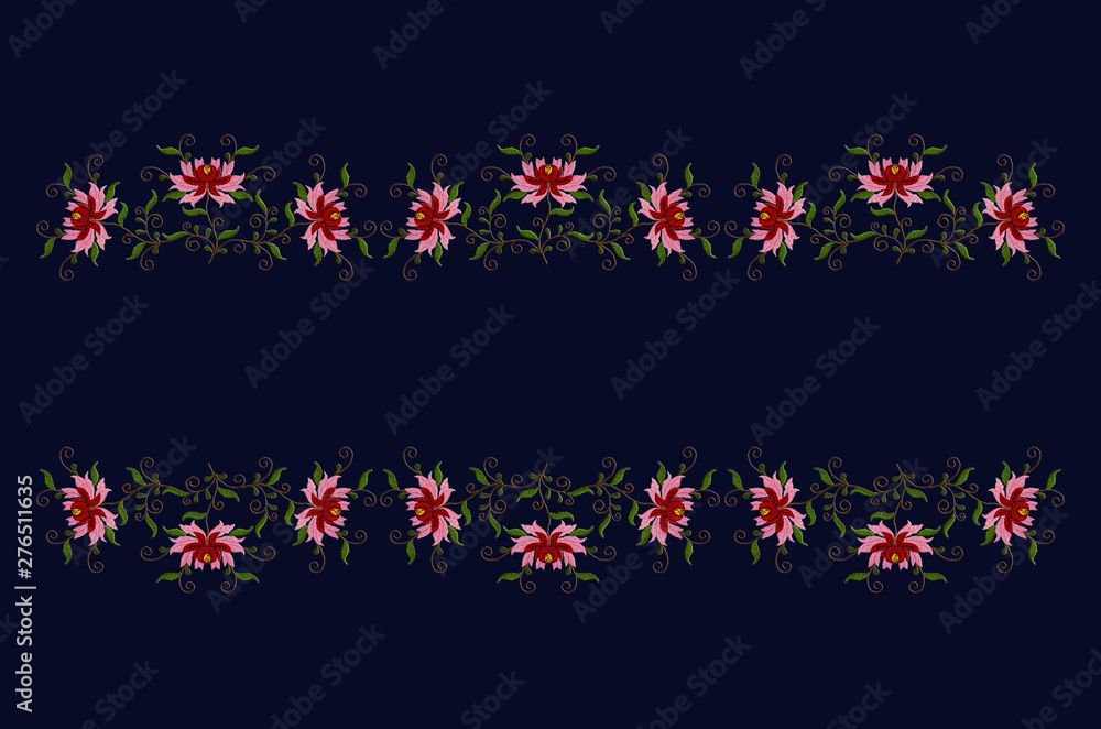 Border of embroidered stylized flowers with red and pink petals on twisted branches with leaves on a dark blue background