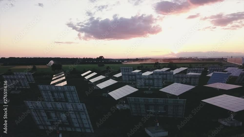 Aerial view solar panel farm producing clean energy at sunset Germany in 4k Aerial view solar panel farm producing clean energy at sunset Germany in 4k