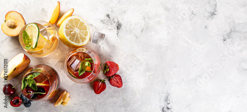 Selection of sangrias - red, pink, white and ingredients, rustic background photo