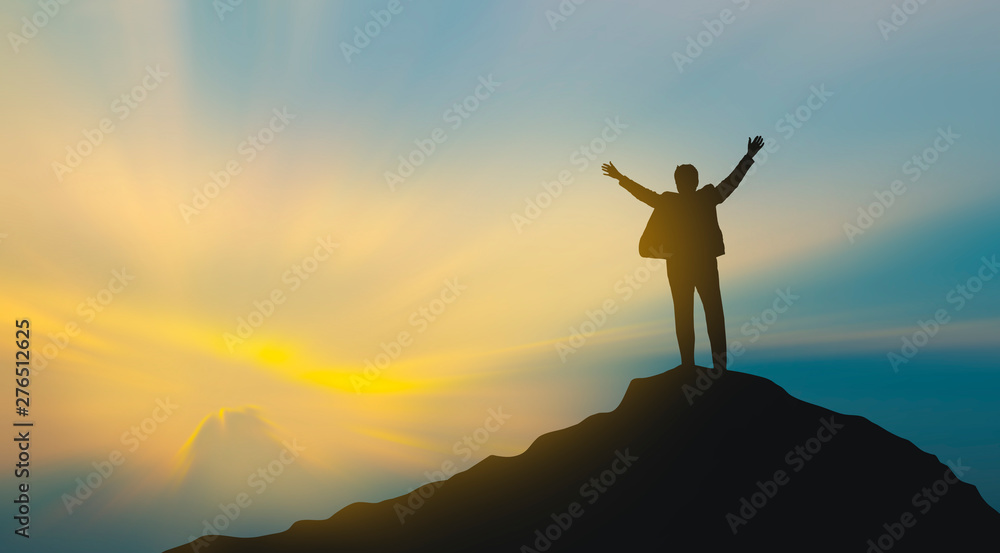 silhouette of man on mountain top over sky and sun light background,business, success, leadership, achievement and people concept