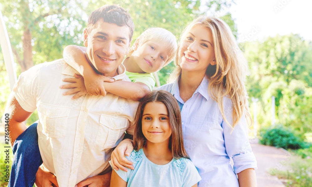 Beautiful smiling Lovely family in park Beautiful smiling Lovely family in park