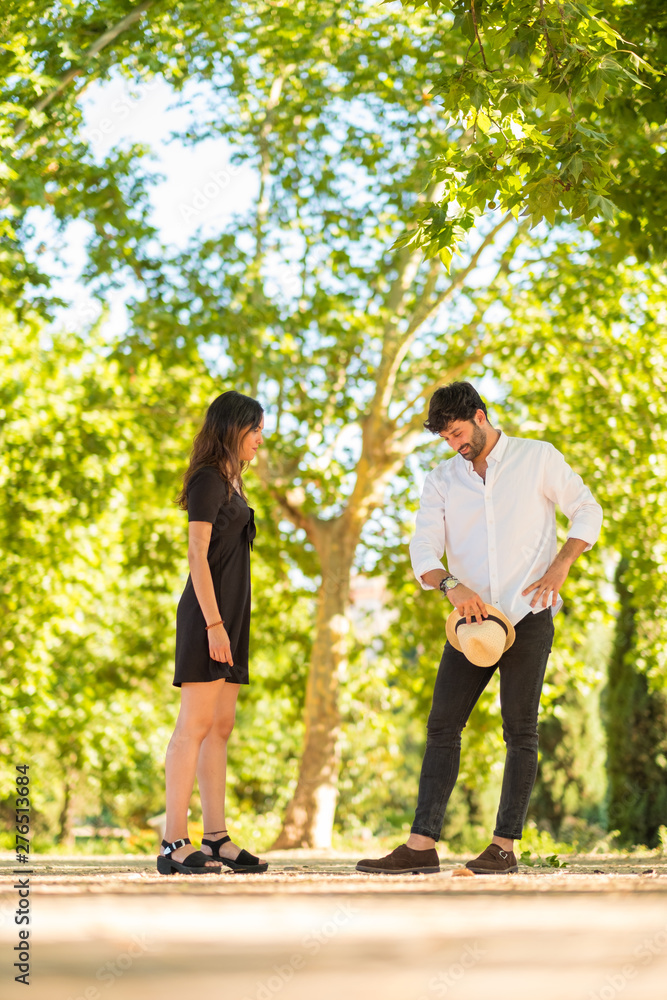 Obraz premium Portrait of a young couple in love enjoying in a city park