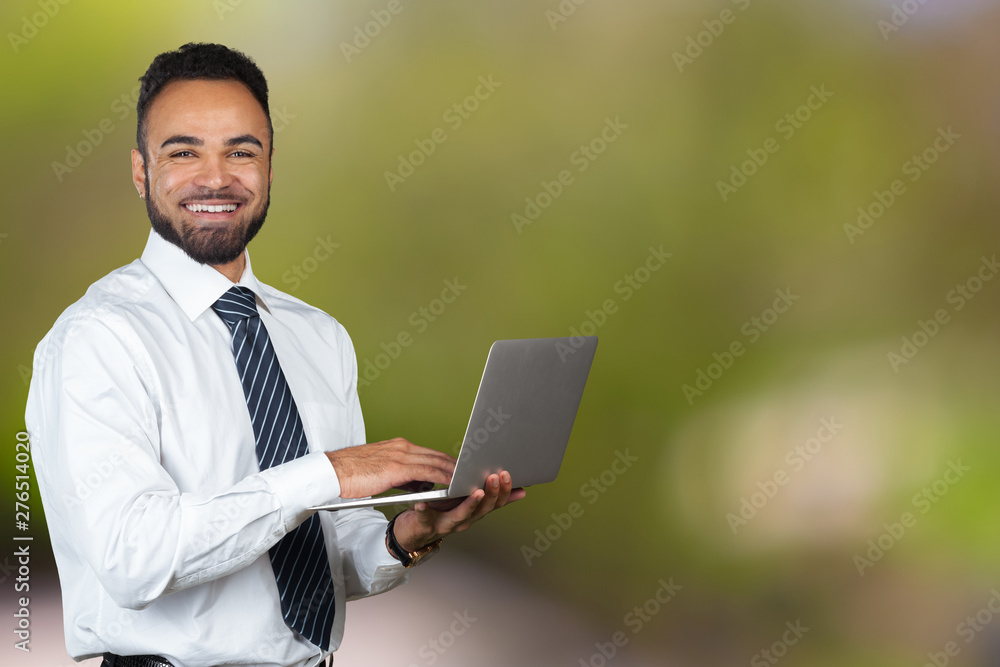 Young Black Male Holding Laptop Isolated portrait Young Black Male Holding Laptop Isolated portrait