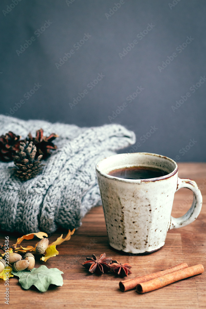coffee cup on the autumn fall leaves and wooden surface background coffee cup on the autumn fall leaves and wooden surface background