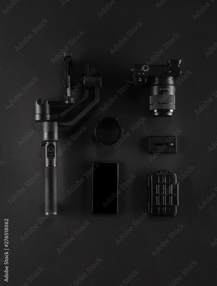 Work space videographer with laptop, digital camera, memory card