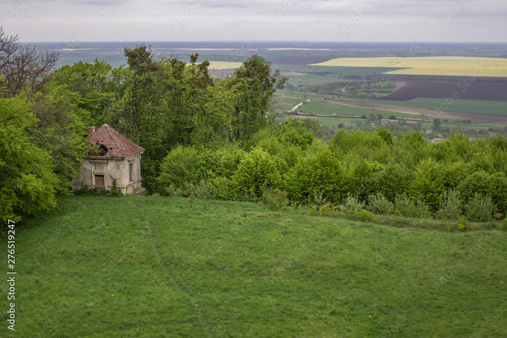 Old makeshift. Lonely building. House at the edge. Barn on the hill. The back yard of the castle. Ancient architecture. The ruins of an abandoned estate. Life among nature. Old makeshift. Lonely building. House at the edge. Barn on the hill. The back yard of the castle. Ancient architecture. The ruins of an abandoned estate. Life among nature.