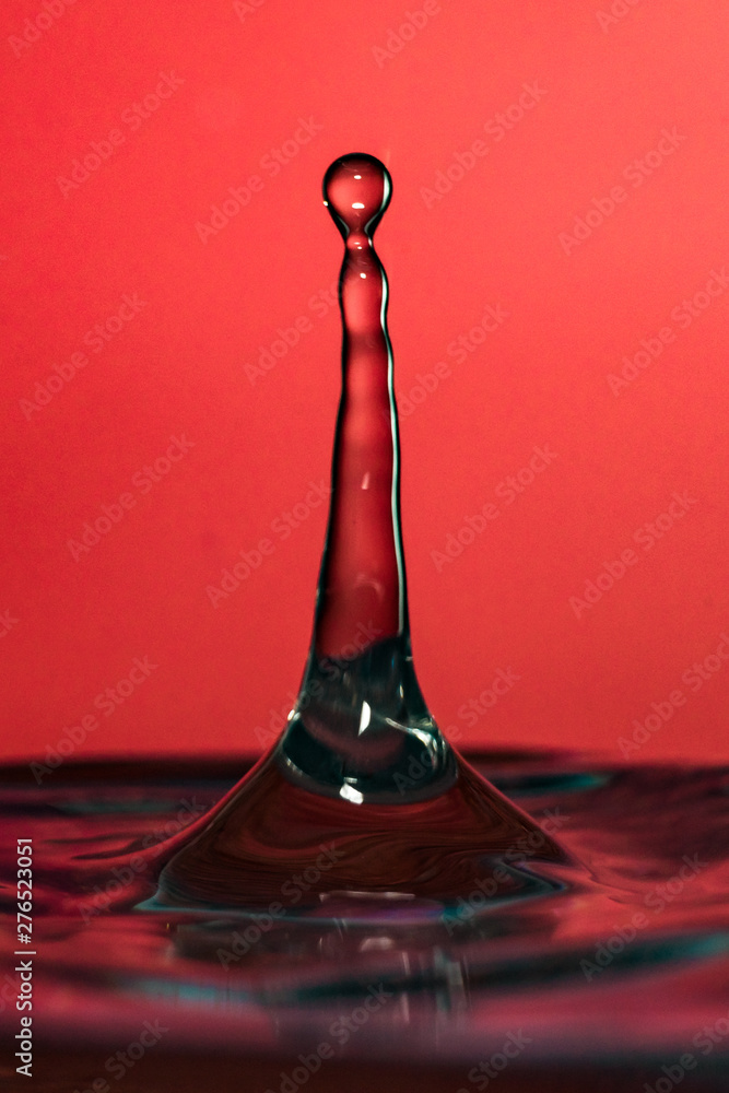 Water splash isolated on yellow background Water splash isolated on yellow background