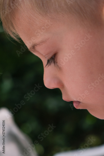 portrait close up of child with sad expression