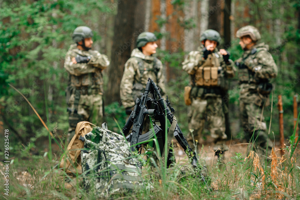 Soldiers in a combat situation. Men play airsoft. Soldiers in a combat situation. Men play airsoft.