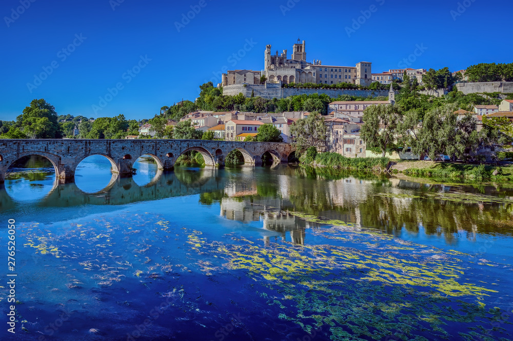 The Old Bridge (Pont Vieux) and St. Nazaire Cathedral in the city of Beziers, Herault, south of France