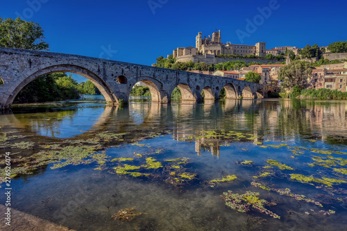 The Old Bridge (Pont Vieux) and St. Nazaire Cathedral in the city of Beziers, Herault, south of France photo