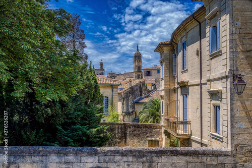 Old medieval stone buildings in the city of Uzes, in the Gard Department of France photo
