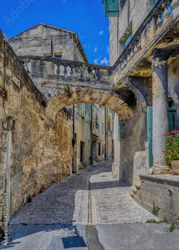 Old medieval stone buildings in the city of Uzes, in the Gard Department of France