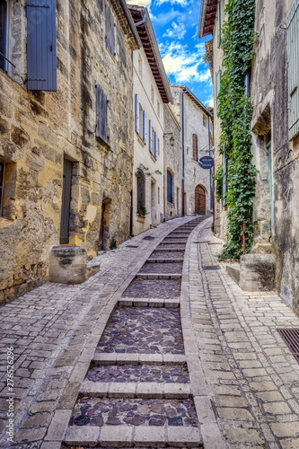 Old medieval stone buildings in the city of Uzes, in the Gard Department of France photo