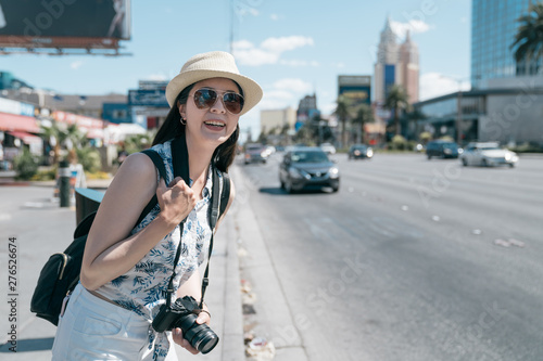 Canvas Print Smiling backpacker girl happy to spend free time walking city center on good warm sunny day