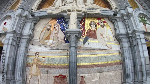 Sculpture of the Holy Mary on the outside of the Rosary Basilica of Lourdes, France photo