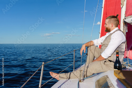 man resting on a sailing boat © Evgeny