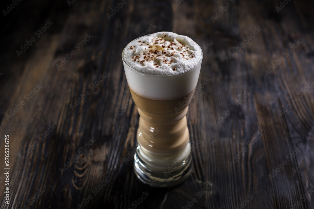 Cup of super awakening coffe latte or cappucino with milk and foam and cinnamon Cup of super awakening coffe latte or cappucino with milk and foam and cinnamon