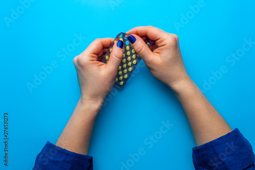 Close-up beautiful female hands with blue manicure