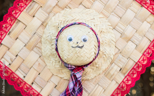 Straw hat with cute face used for decoration at the June Festivals (aka festas de Sao Joao) in Oeiras, Piaui (Brazil) photo