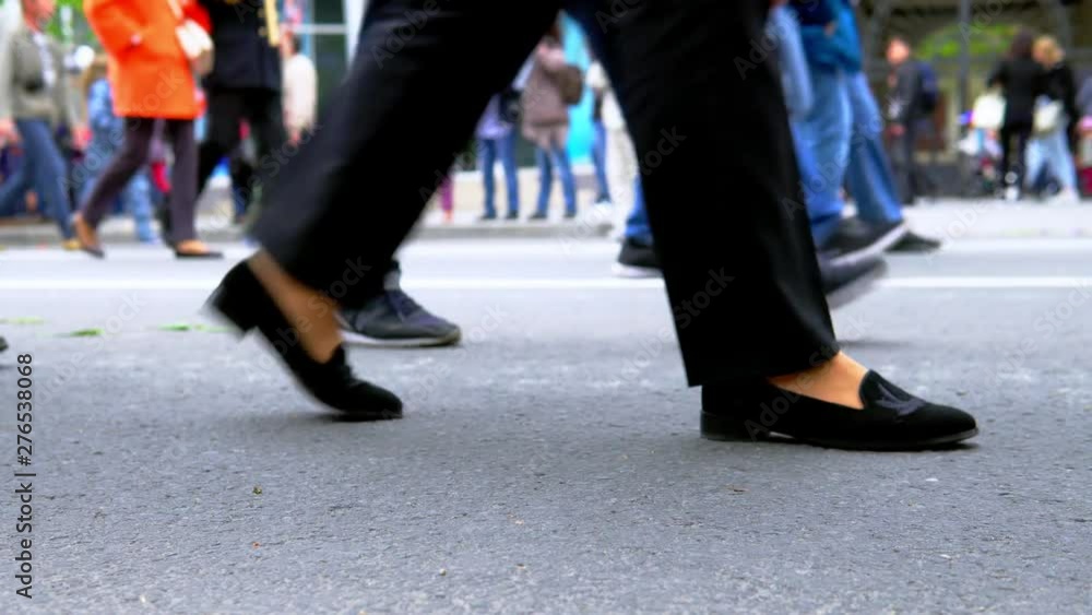 Legs of people walking and standing in line outside. Legs of people walking and standing in line outside.