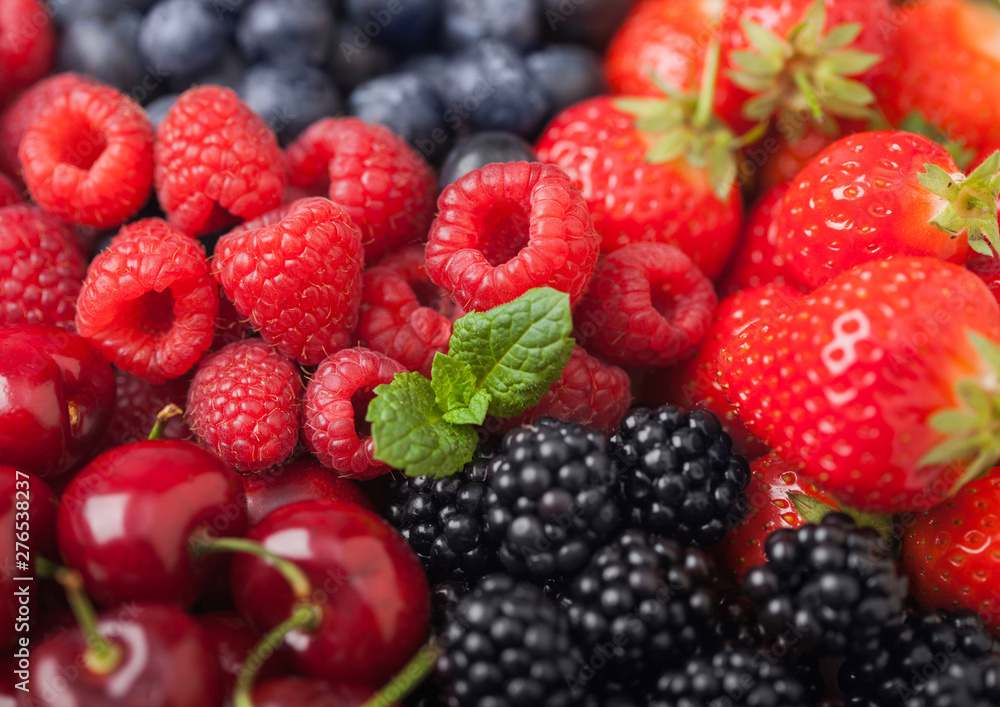 Fresh organic summer berries mix. Raspberries, strawberries, blueberries, blackberries and cherries. Macro. Close up Fresh organic summer berries mix. Raspberries, strawberries, blueberries, blackberries and cherries. Macro. Close up