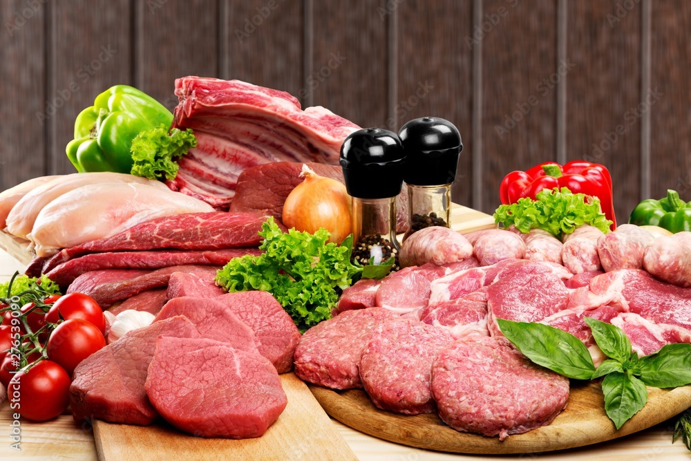 Fresh Raw Meat Background with vegetables Fresh Raw Meat Background with vegetables