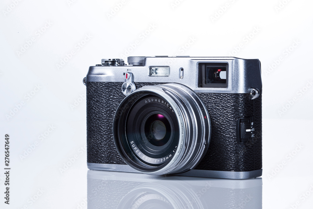 Classic digital camera on white background