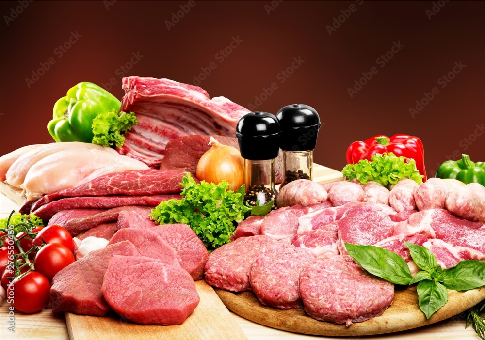 Fresh Raw Meat Background with vegetables Fresh Raw Meat Background with vegetables
