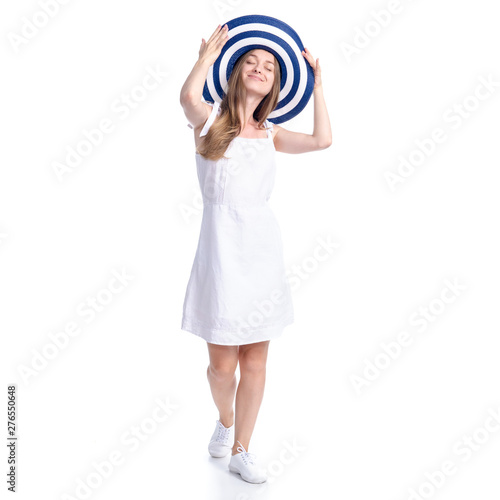 Woman in dress and summer hat smiling happiness walking goes on white background isolation © Kabardins photo