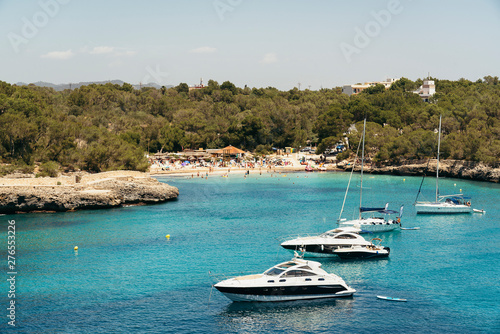 Yatchs in urquoise water in Cala Mondrago view from the sea, Mondrago Natural Park, Majorca. © Dartagnan1980