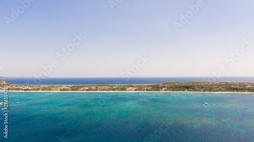 Sulu Sea, view of the island of Boracay, Philippines. Seascape, blue sea and a large densely populated island, aerial view.