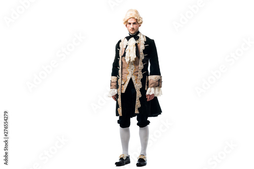Photography handsome victorian man in wig standing and looking at camera isolated on white