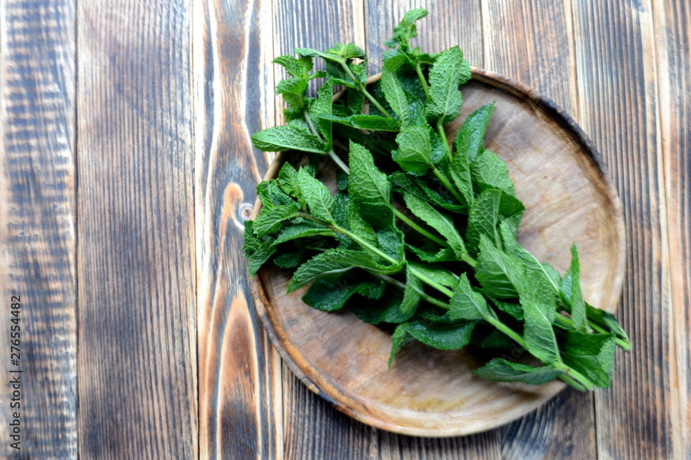 Fresh mint leaves on wooden background Top view Fresh mint leaves on wooden background Top view