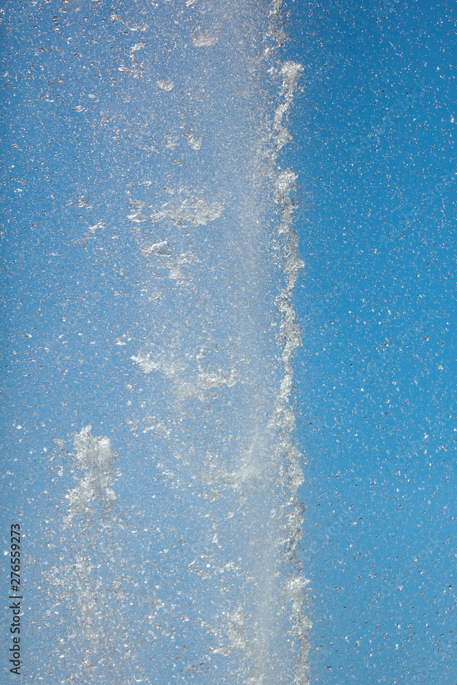 Splashes of water against the blue sky