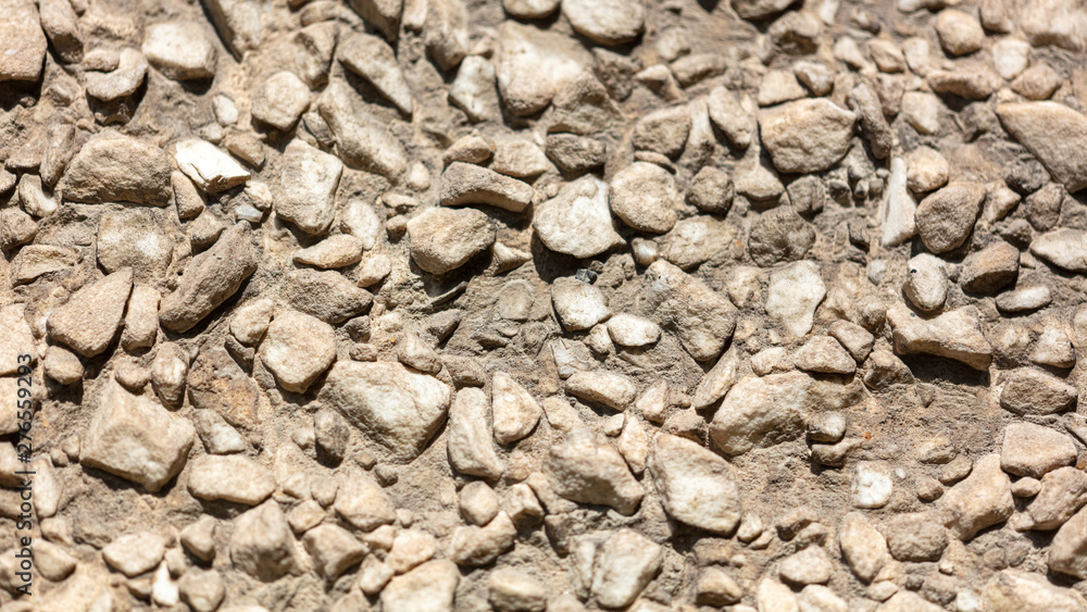 Stone rubble in the concrete wall as background Stone rubble in the concrete wall as background