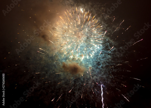 Beautiful sparks from fireworks in the sky at night