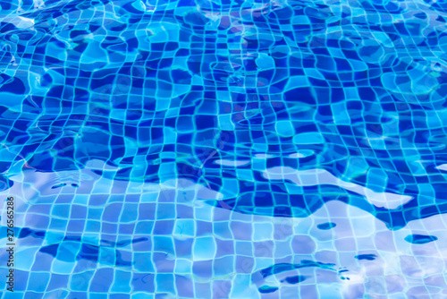 Blurry Surface of the pool with blue water.abstract background.
