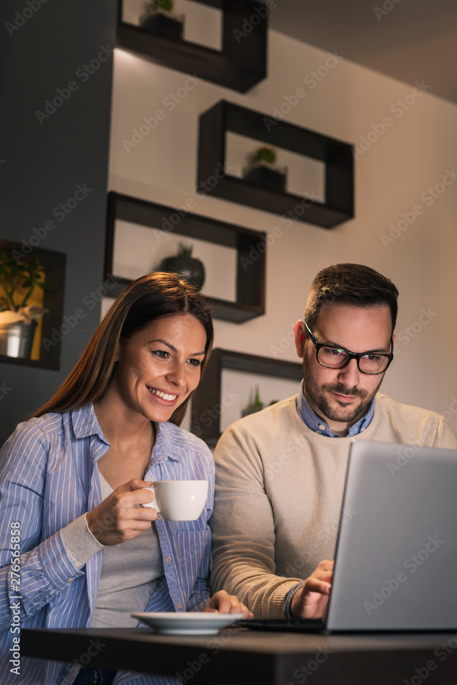 Couple working on a laptop computer Couple working on a laptop computer