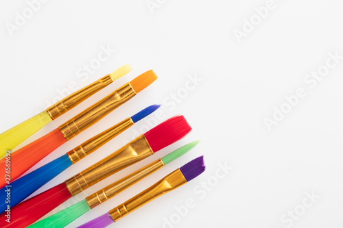 Colourful creative paintbrush art supply background