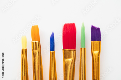 Colourful creative paintbrush art supply background