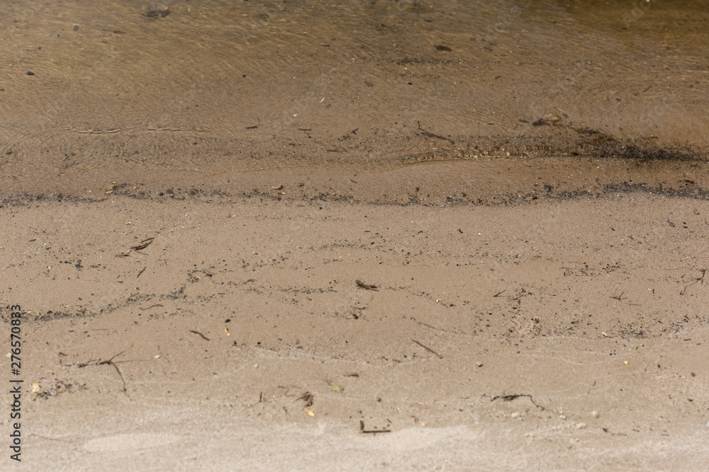 brown textured surface with sand and water with copy space brown textured surface with sand and water with copy space