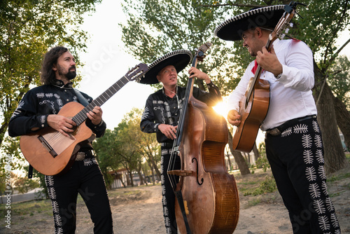Mexican musicians mariachi band street concert