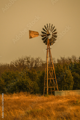 Windmill at dusk on a windy day